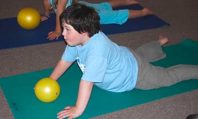 Boy doing arm and shoulder strengthening exercise